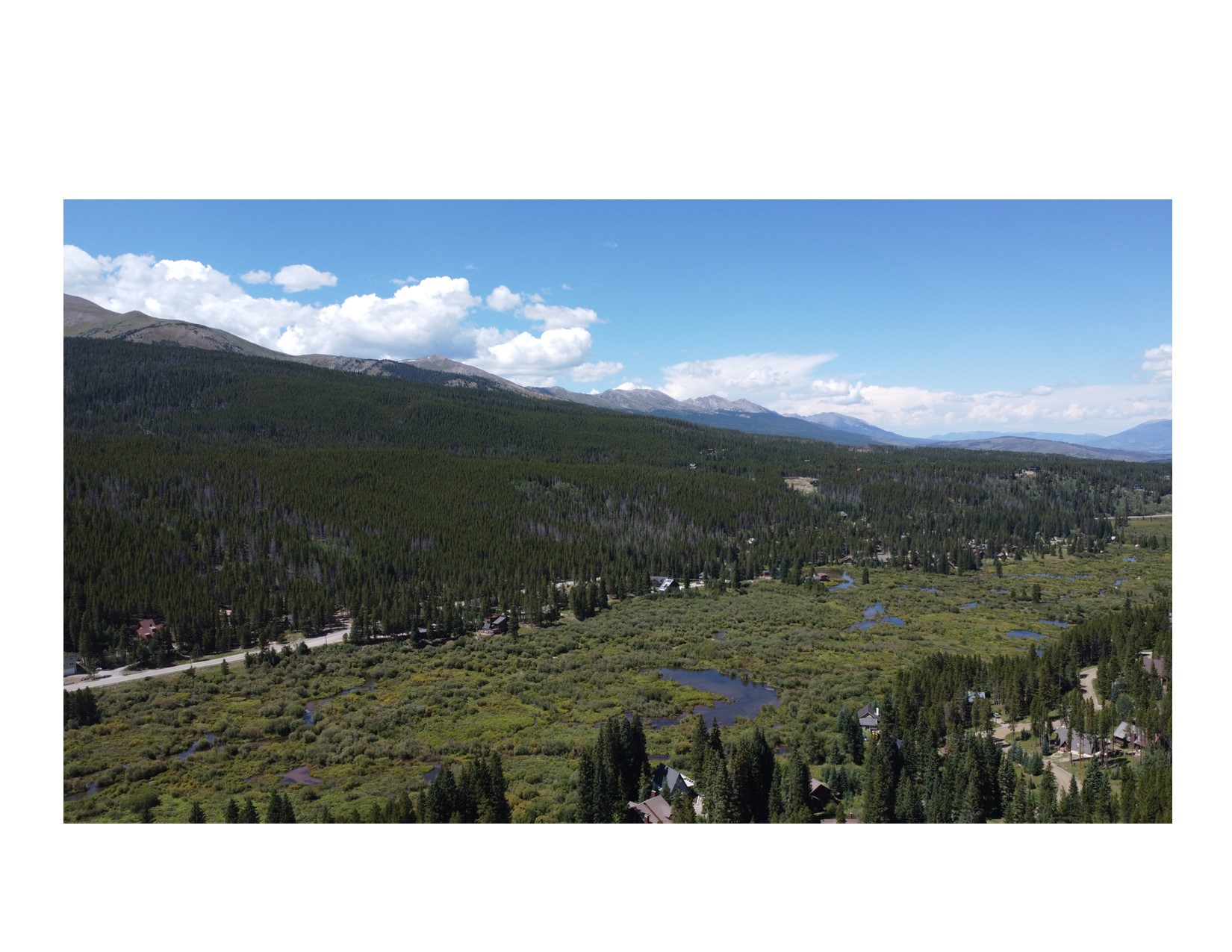 East side view from the south with wetlands before